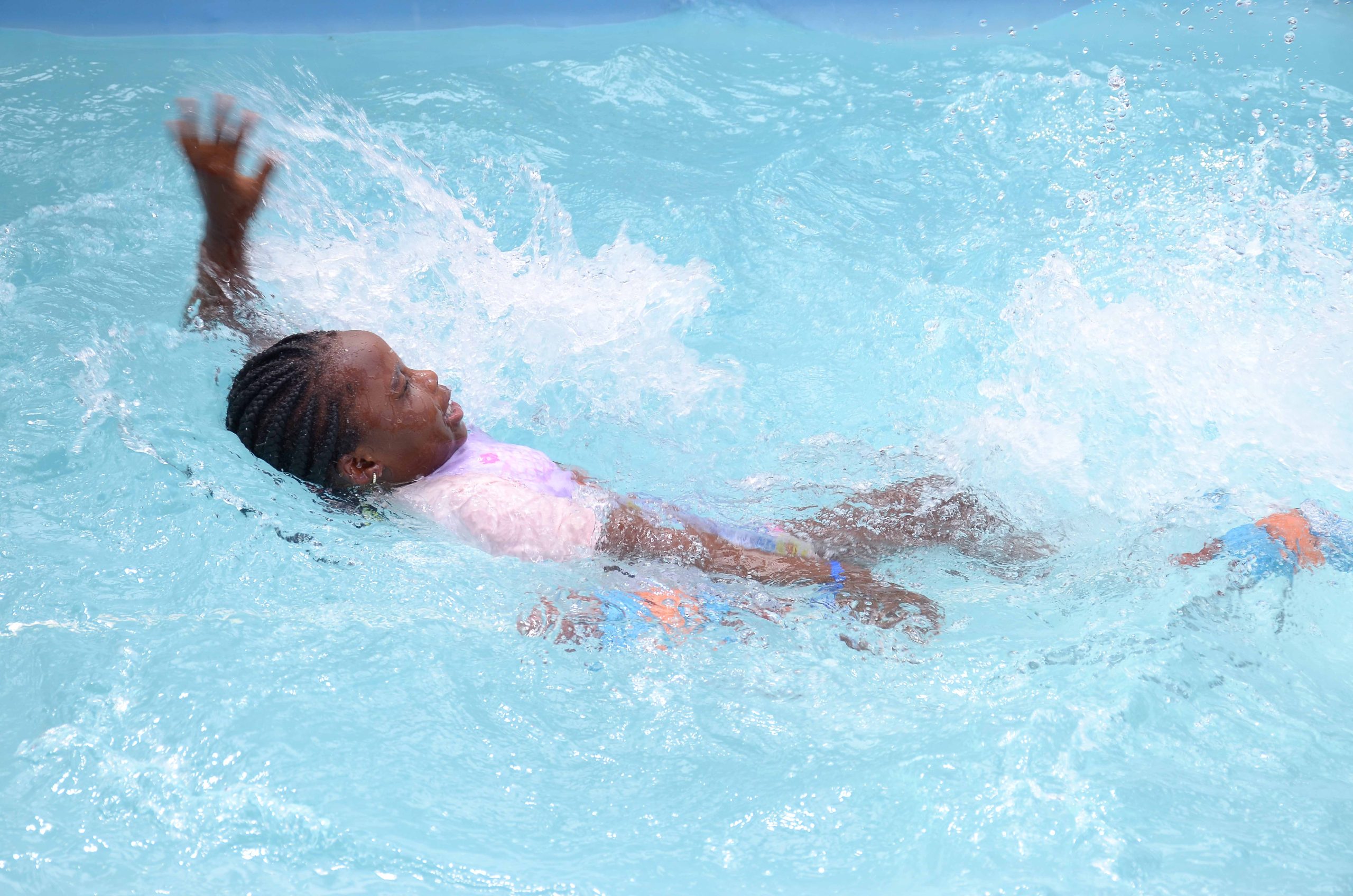 Swim instructor with children in the pool